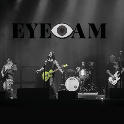 Eye Am - Dreams Always Die With The Sun. A black and white shot of the band, except for the green guitar.