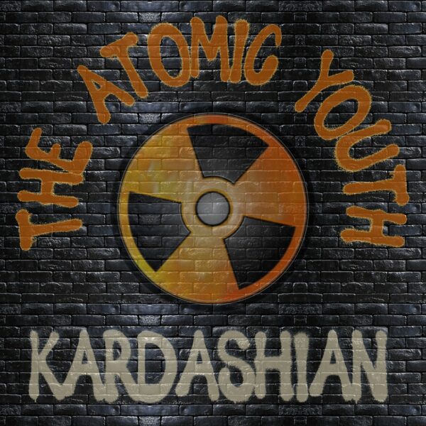 The Atomic Youth - Kardashian. Styled to look like it's spray painted on a dark brick wall.