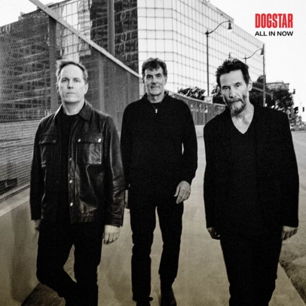 Dogstar band members standing in front of a building.